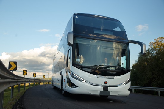 A white bus on the road